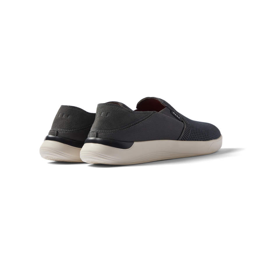 Neptune Slip-On men's black slip-on shoe facing back with cushioned heel and lightweight, breathable upper material.