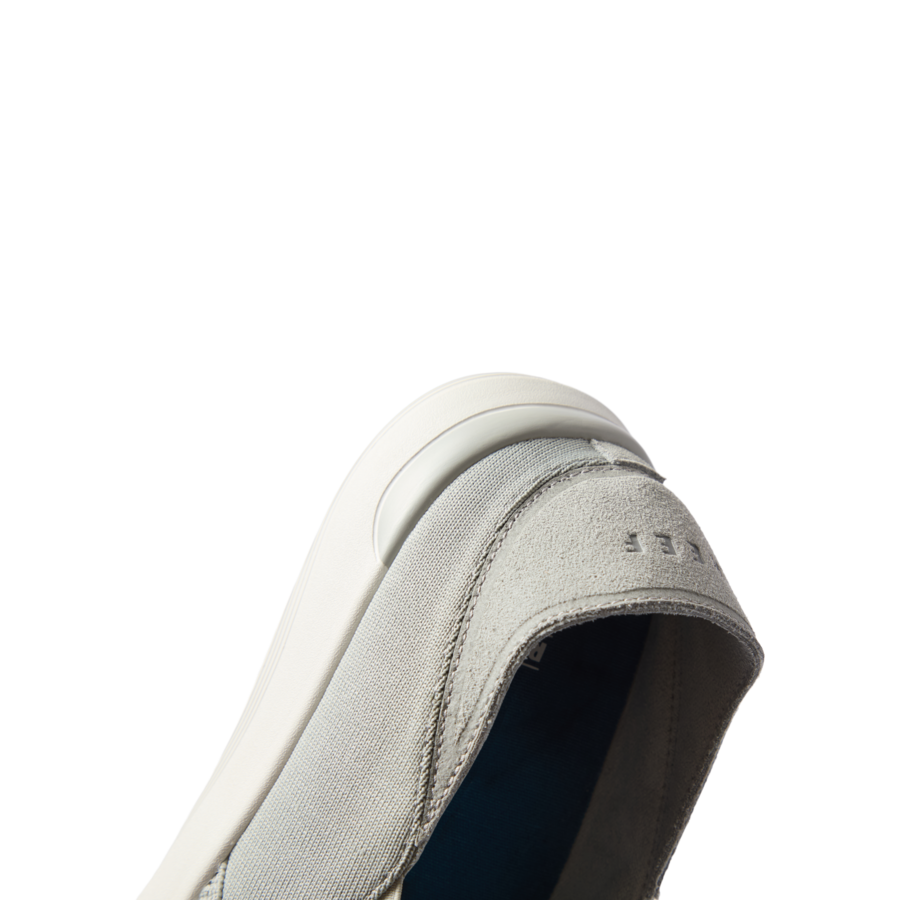 Neptune Slip-On men's shoe facing left, close-up of front and side showing water-friendly materials and cushioning.