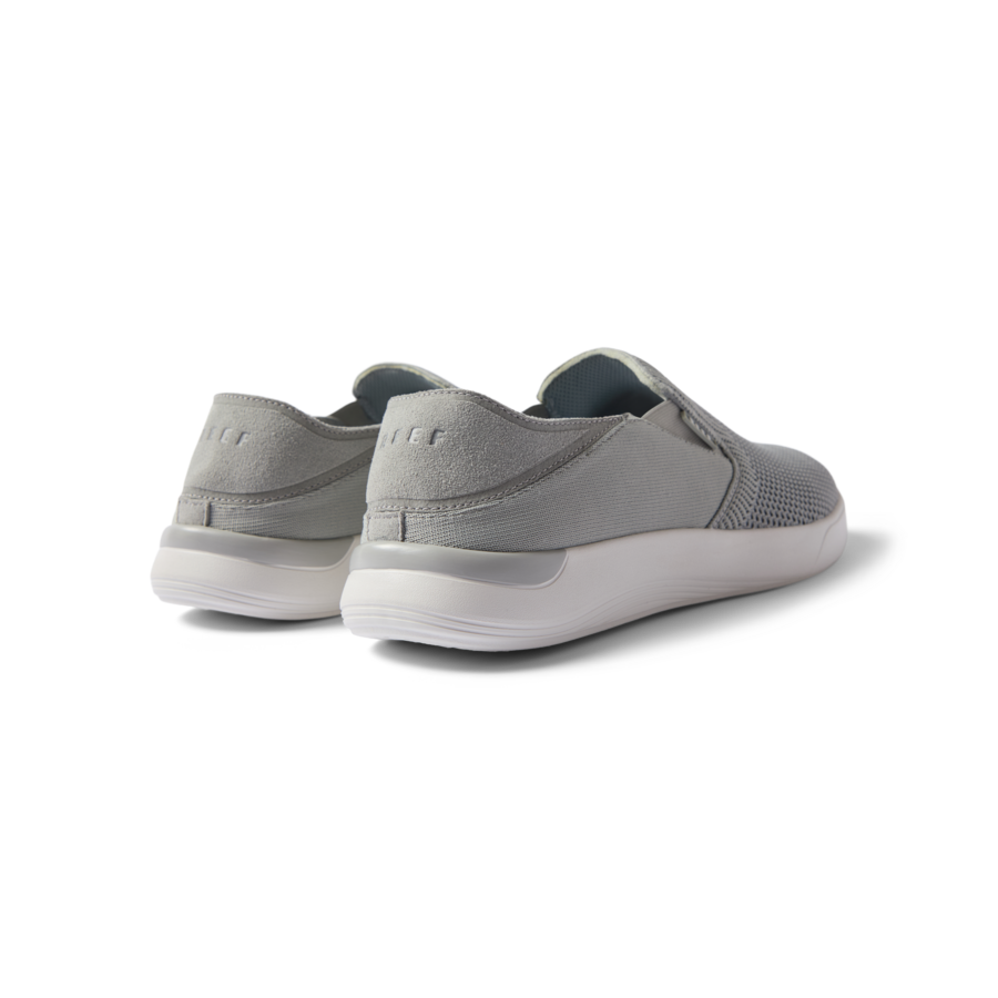 Neptune Slip-On men's grey slip-on shoes facing away showing heel, soft cushioning, and arch support for beach comfort.