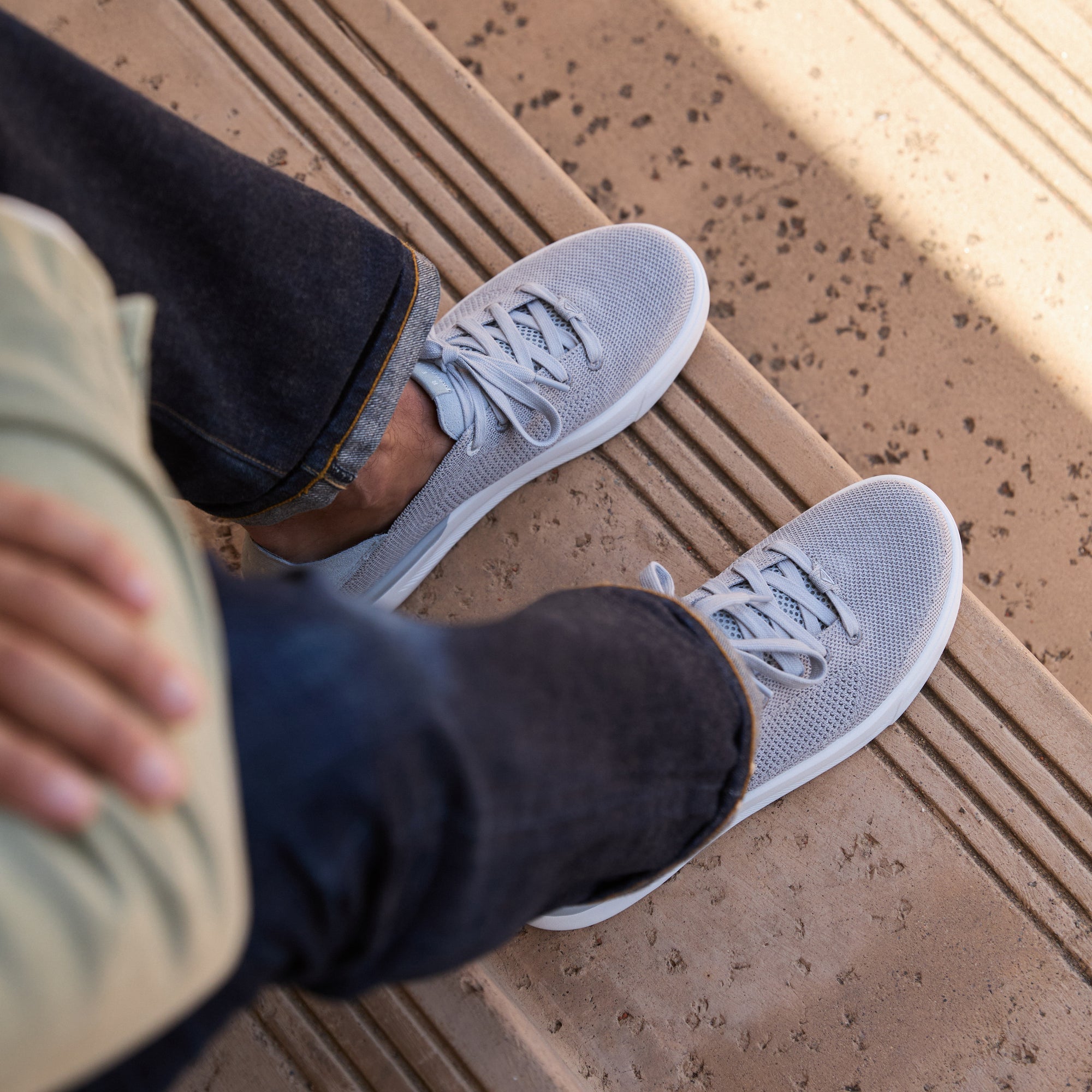 Neptune HT facing forward on feet wearing dark jeans, men's grey water-friendly sneaker with REEFlex cushioning and arch support