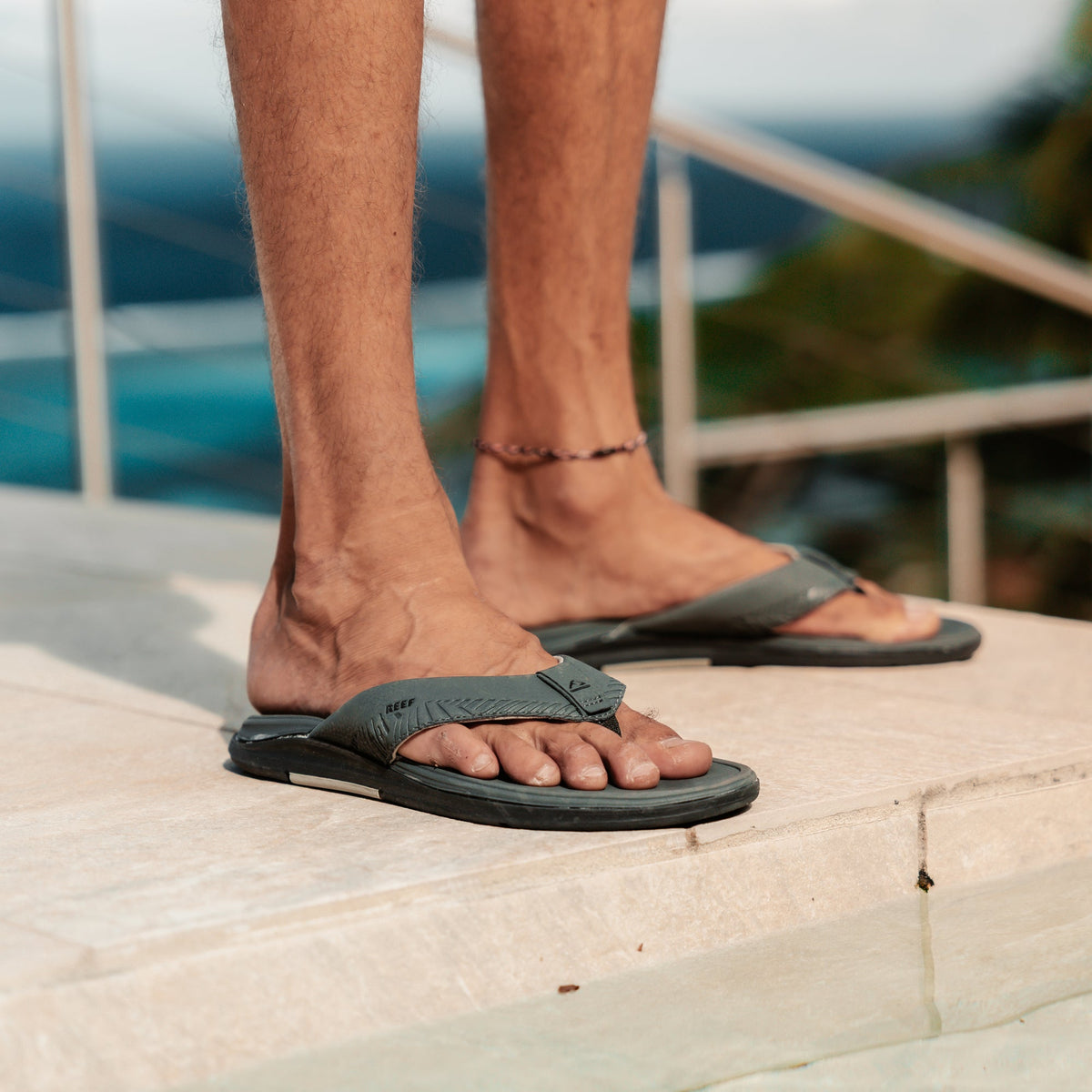 Offshore men's grey flip-flops facing right, showing top view with extra cushioning and arch support for beach comfort.