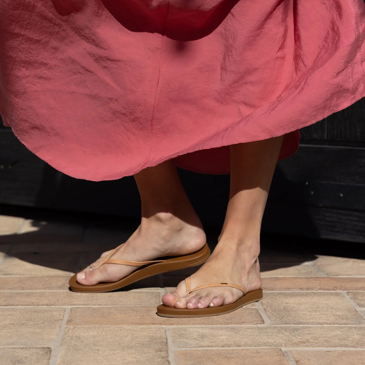 Cushion Slim flip flops facing right, showing casual water-friendly sandals with arch support and slim straps on feet