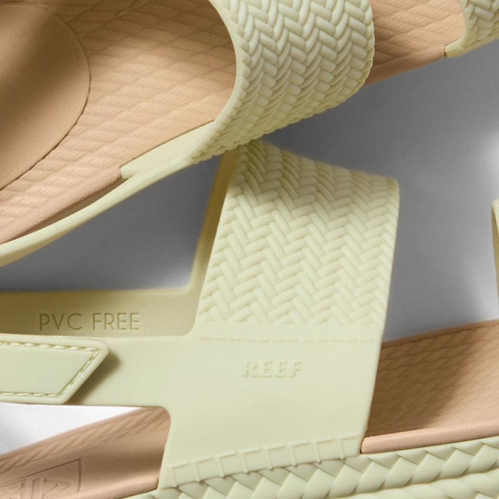 Close-up of the side and heel of the Reef Water Vista sandal in beige with molded footbed and anatomical arch support facing right