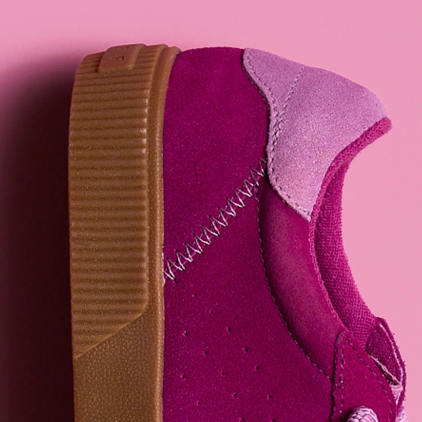 Lay Day Seas women's left shoe heel close-up showing purple suede, pink accent, and cushioned brown sole facing left