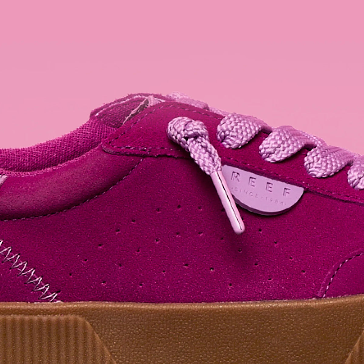 Close-up side view of the left Lay Day Seas sneaker in orchid with REEF branding, durable sole, and comfort features.