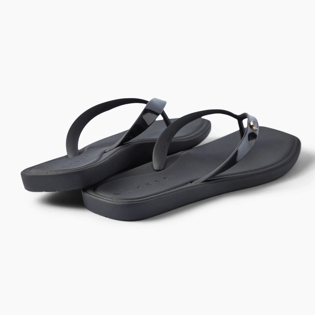 Solaye black flip flops facing right with sleek straps and cushioned footbeds for beach days