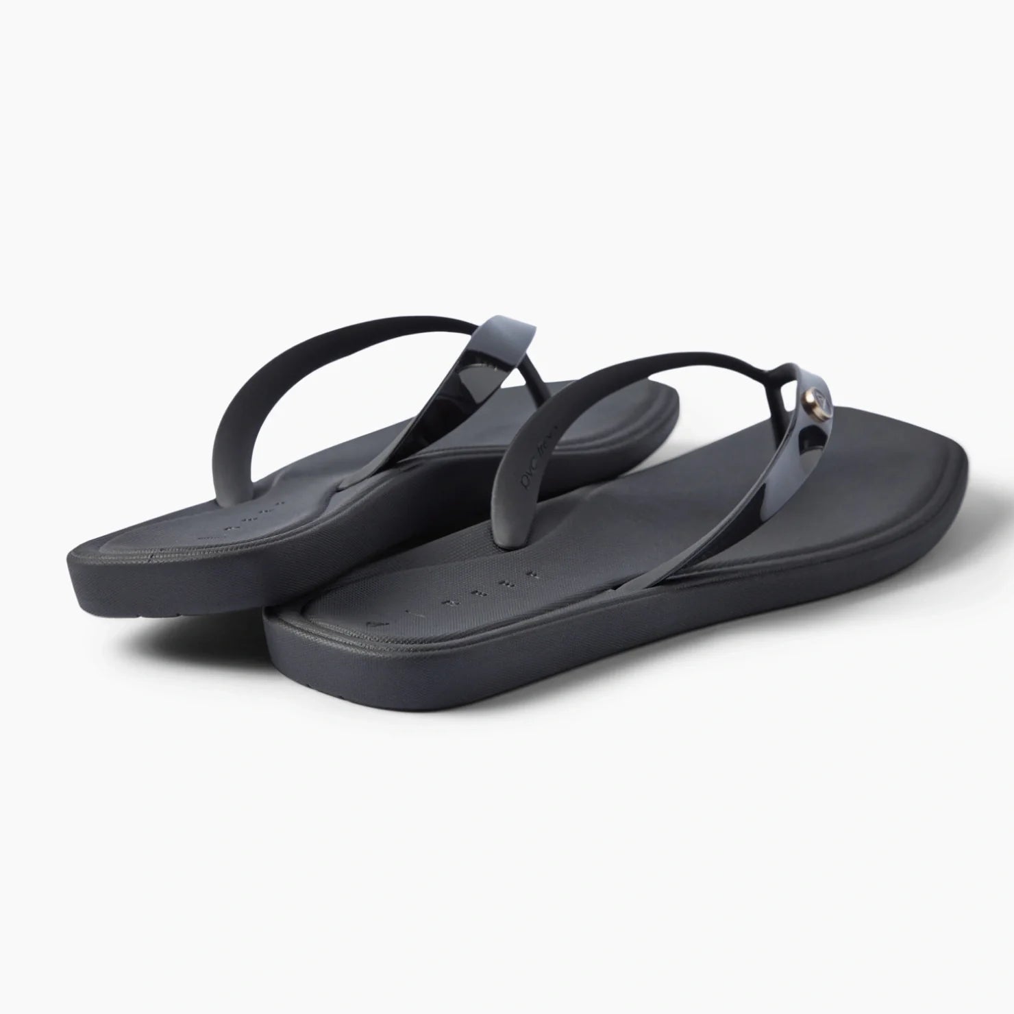 Solaye black flip flops facing right with sleek straps and cushioned footbeds for beach days