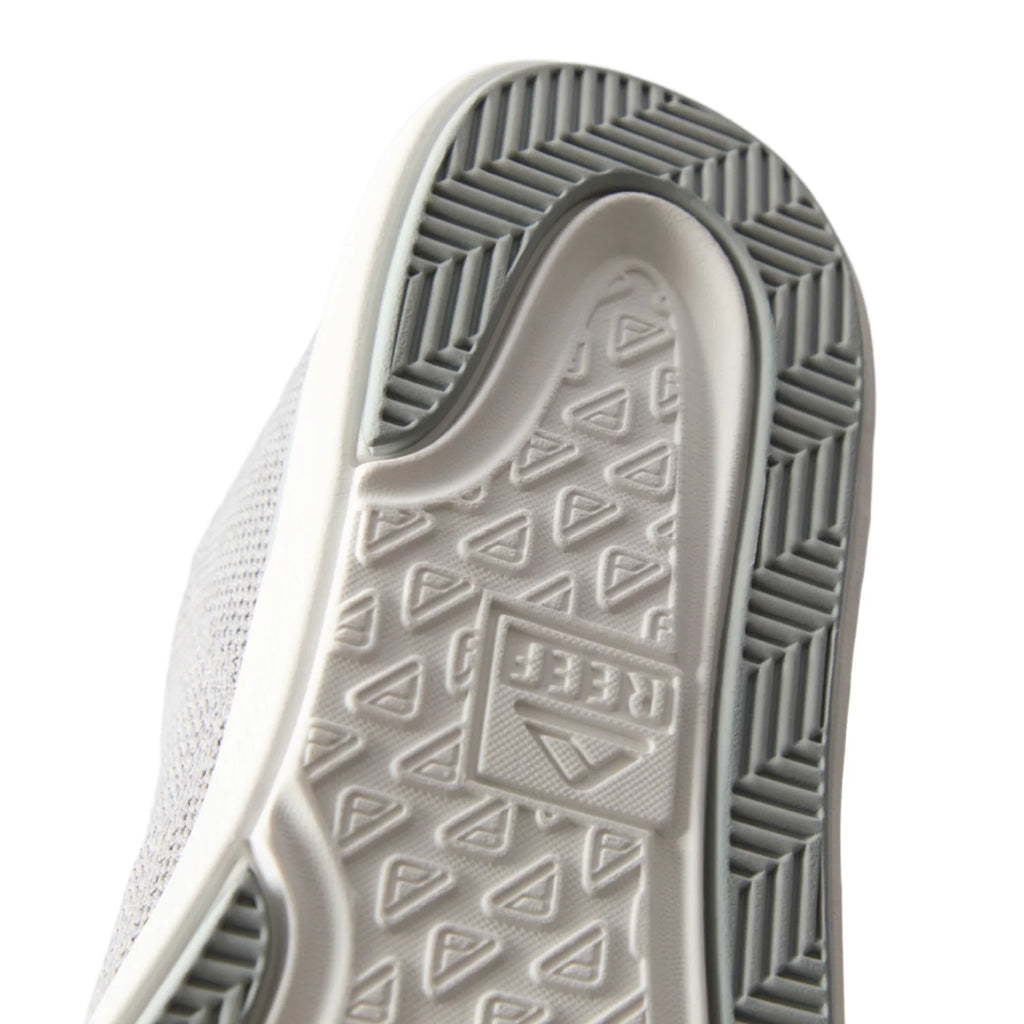 Neptune HT close-up of grey sneaker sole facing up with textured tread and REEF logo, designed for durable comfort and support
