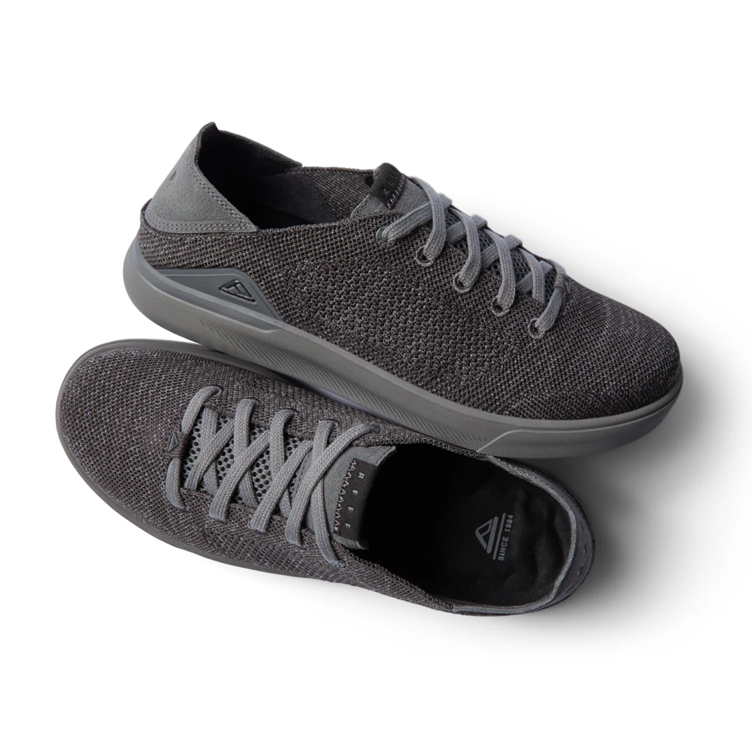 Neptune HT men's black sneaker pair with lightweight breathable knit upper, REEFlex cushioning, and anatomical arch support.
