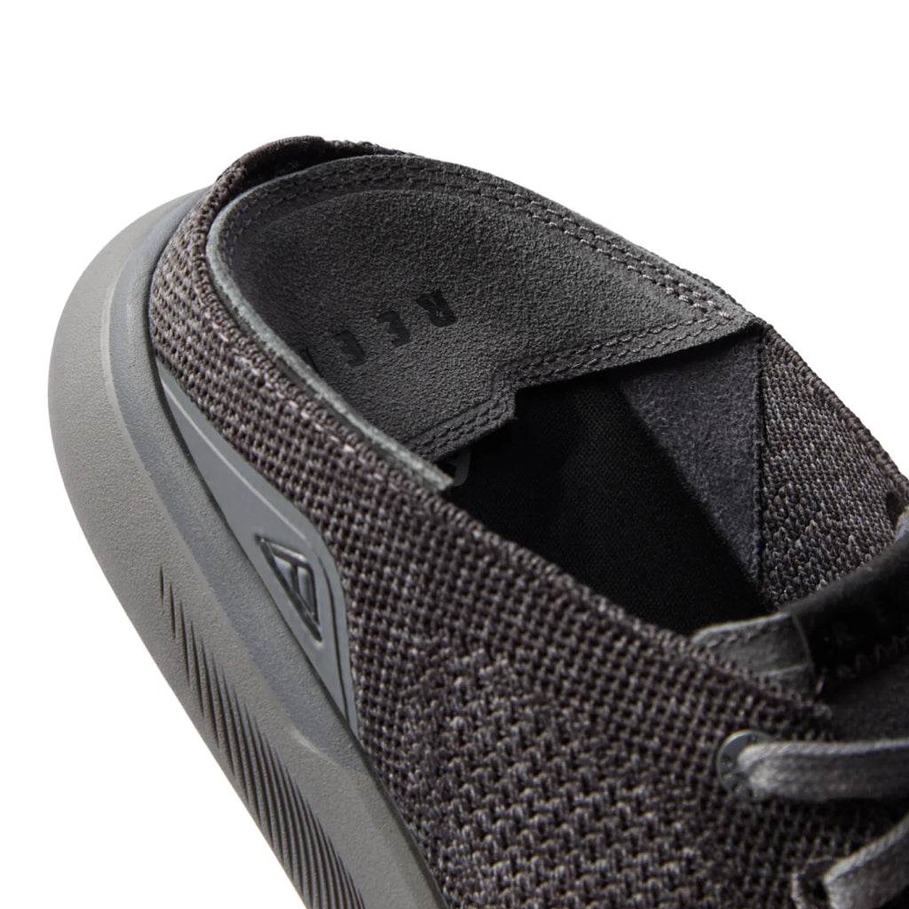 Close-up of the men's Neptune HT black sneaker heel and collar with soft cushioning and anatomical arch support features.