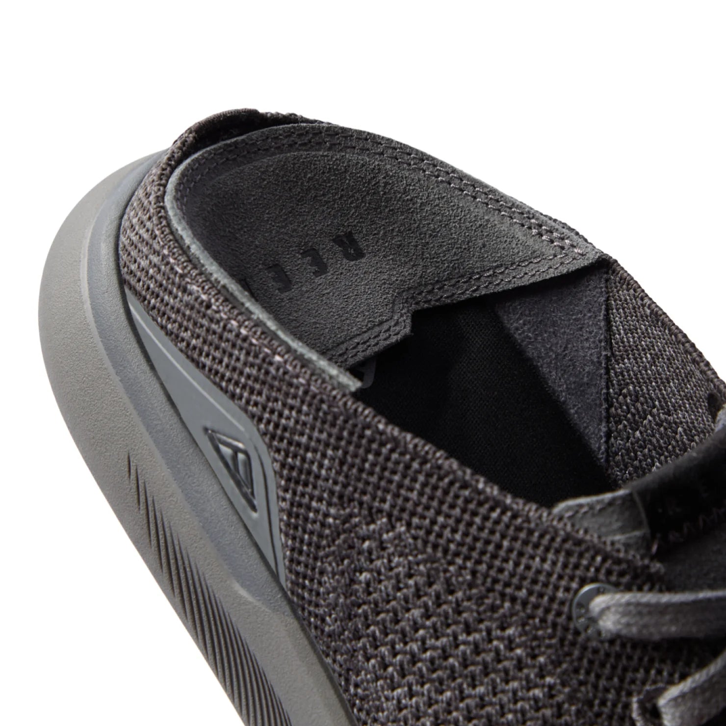 Close-up of the men's Neptune HT black sneaker heel and collar with soft cushioning and anatomical arch support features.
