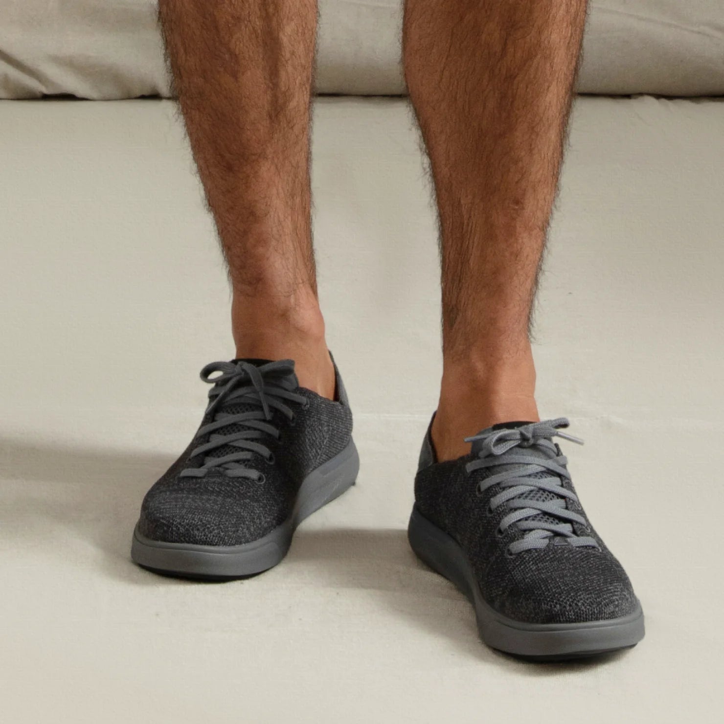 Neptune HT facing forward on feet, men's black sneaker with breathable knit upper, REEFlex cushioning, and arch support.