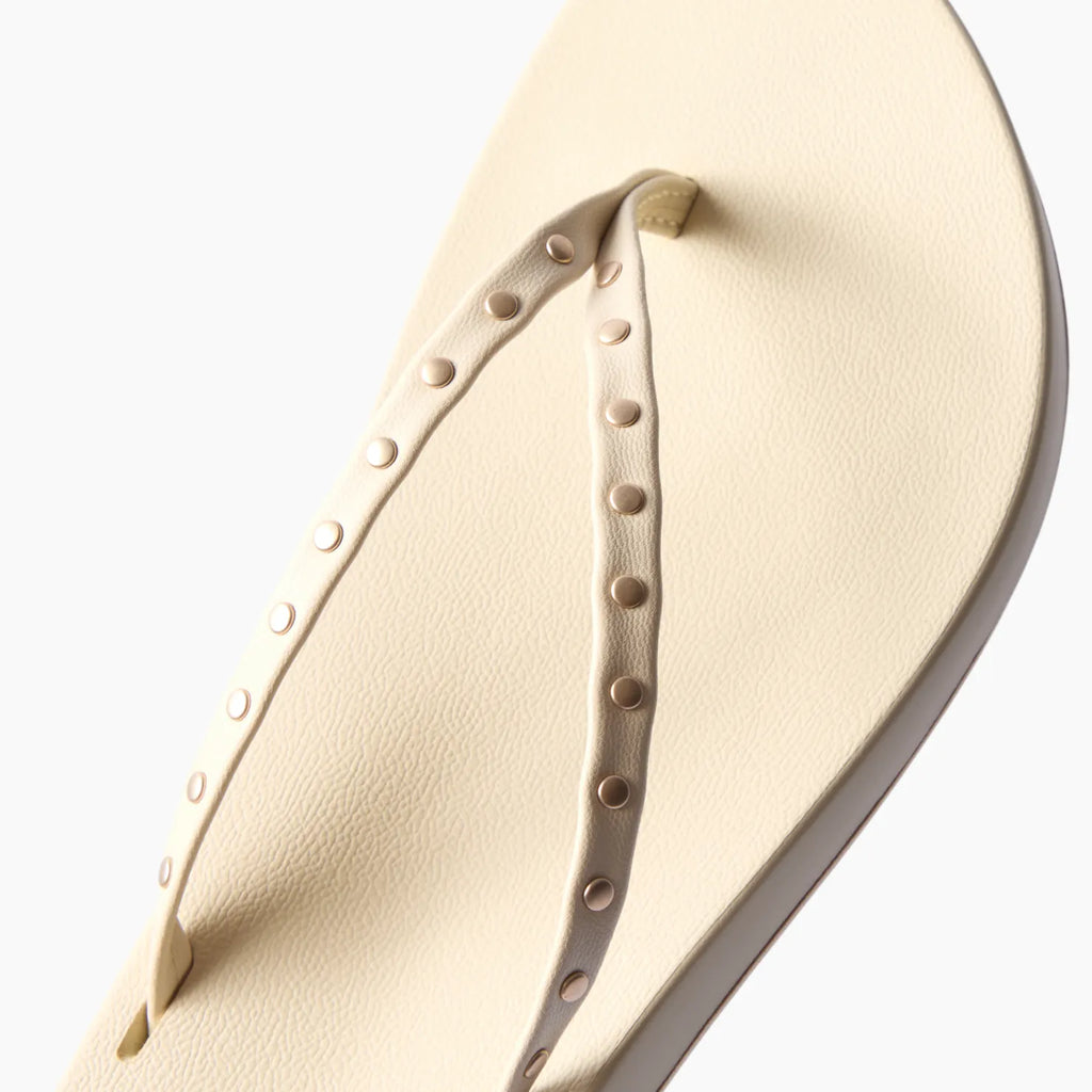 Close-up of the top strap and footbed of the Cushion Slim Studs sandal facing left, featuring comfort and durability.
