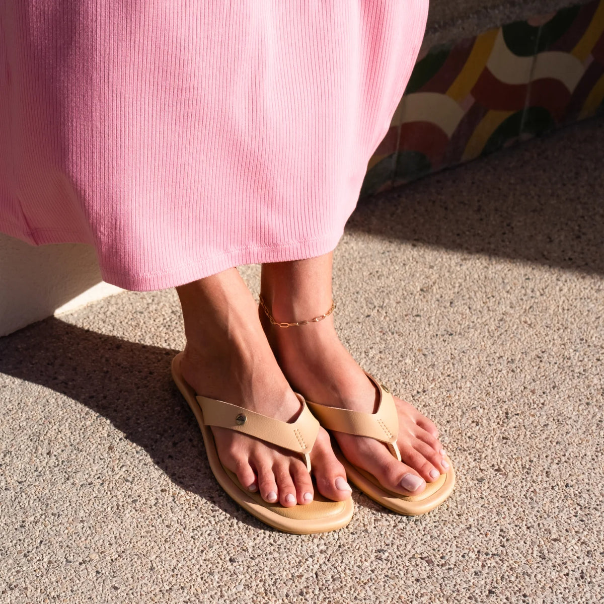 Willow Ella women's sandals facing forward, beige with molded footbed and soft-rebound cushioning, worn with pink dress