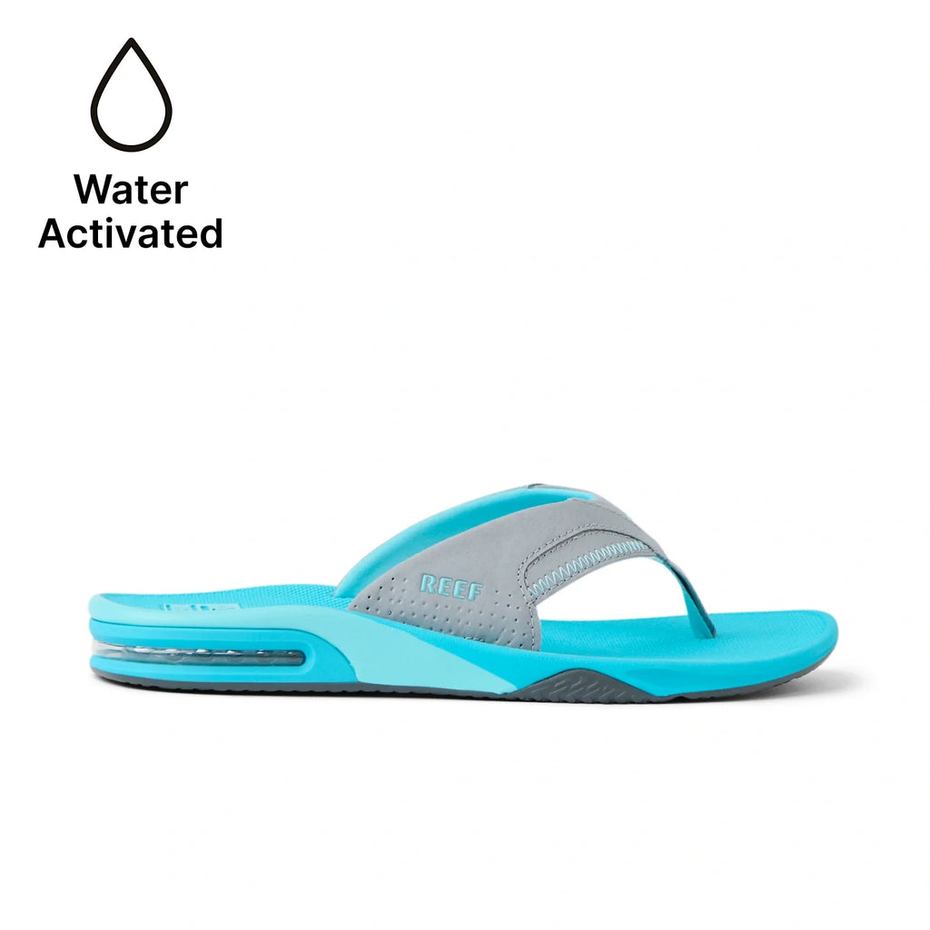 Fanning men's aqua blue and gray flip flop facing right, close-up side view with anatomical arch support and cushioning.
