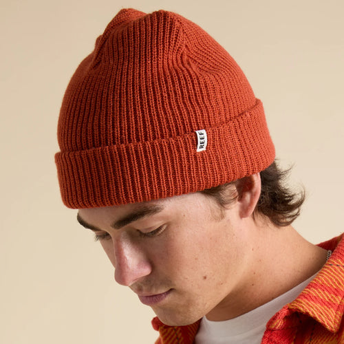Unisex Alyx Beanie in chili red, close-up side view of surf-inspired knit hat with REEF tag, comfort-focused design.