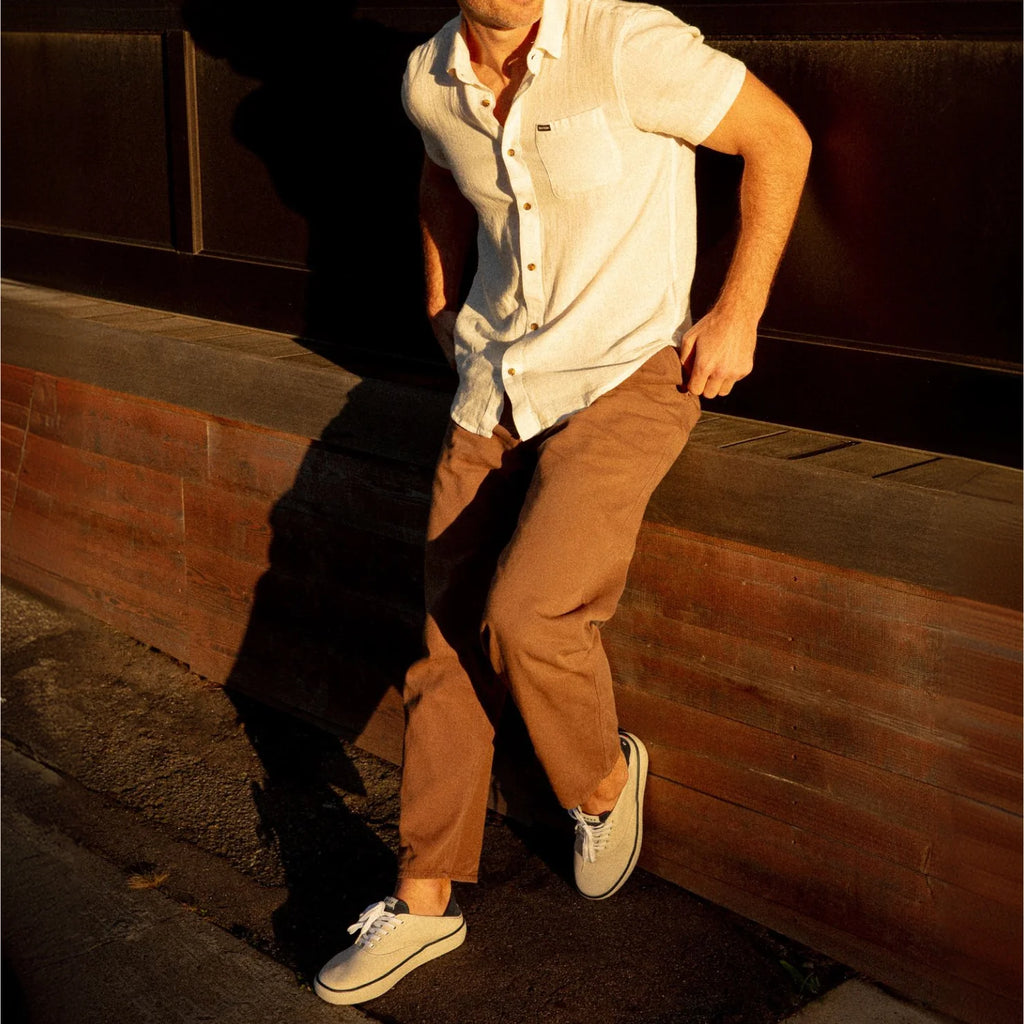Man wearing Neptune Lido sneakers facing right, showing side view with surf-inspired comfort and water-friendly design.