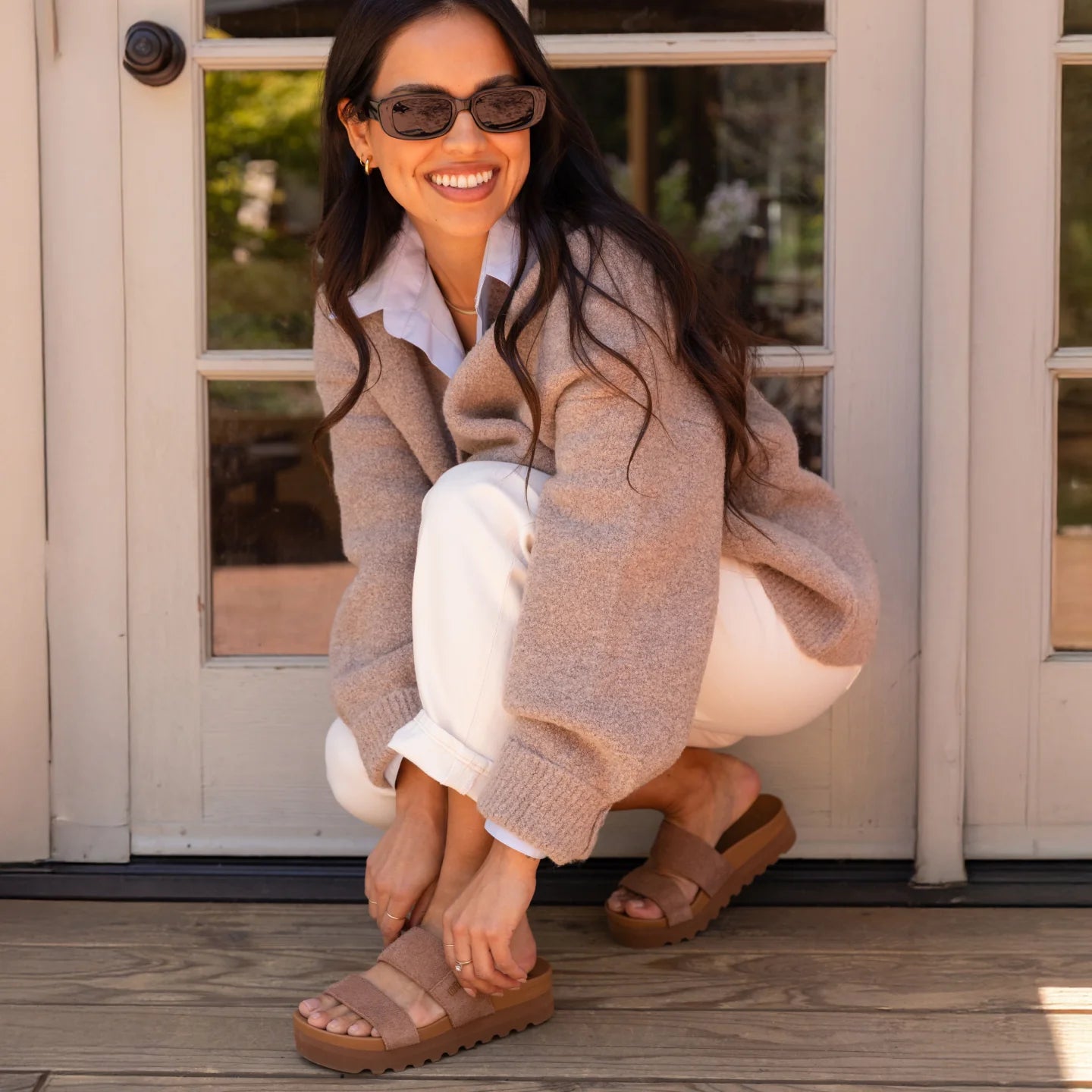 Woman crouching outdoors wearing Cushion Vista Hi sandals facing forward with soft-rebound cushioning and arch support