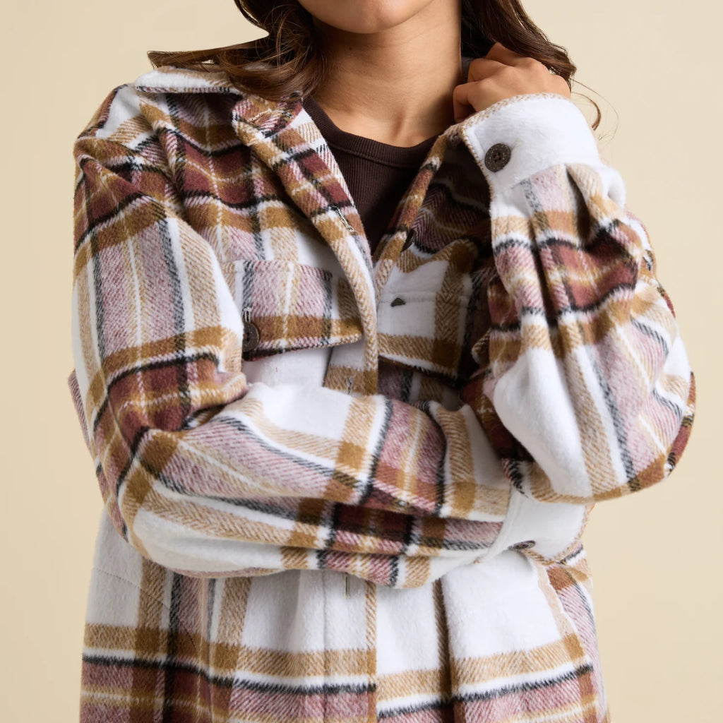 Victoria Shacket close-up showing front chest pocket and cuff with buttons in brown and white plaid pattern