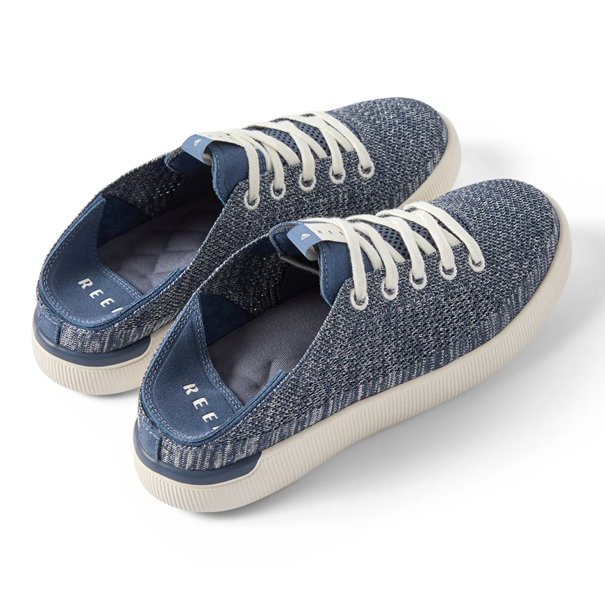 Pair of Reef Neptune women's sneakers facing right, showing top and side with cushioned, textured knit design.