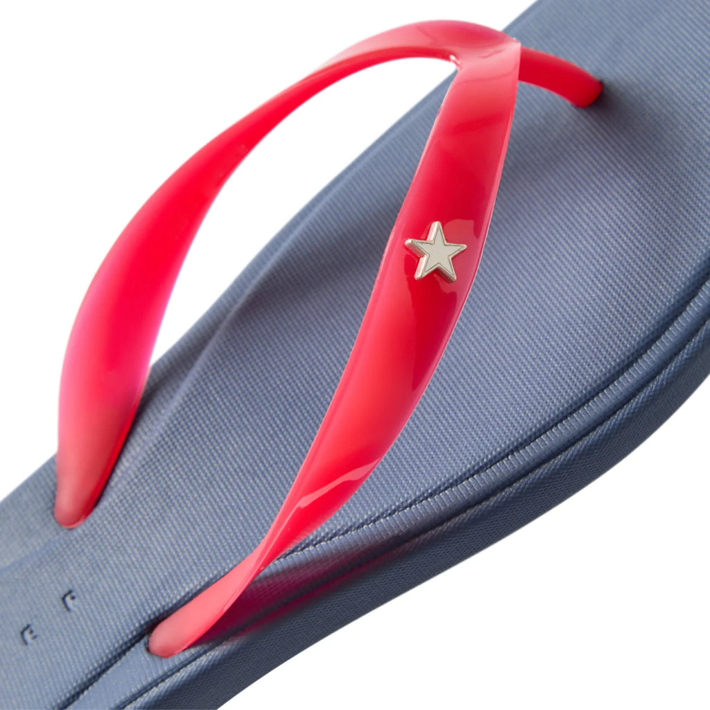 Close-up of Solaye women's flip flop showing top front straps in red with star detail on blue footbed, beach-ready comfort sandals.