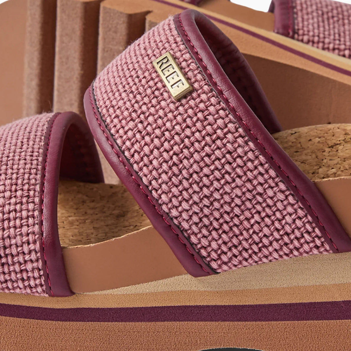 Close-up of the left side of Cushion Vista Higher sandal in burgundy canvas with anatomical arch support and cork footbed.