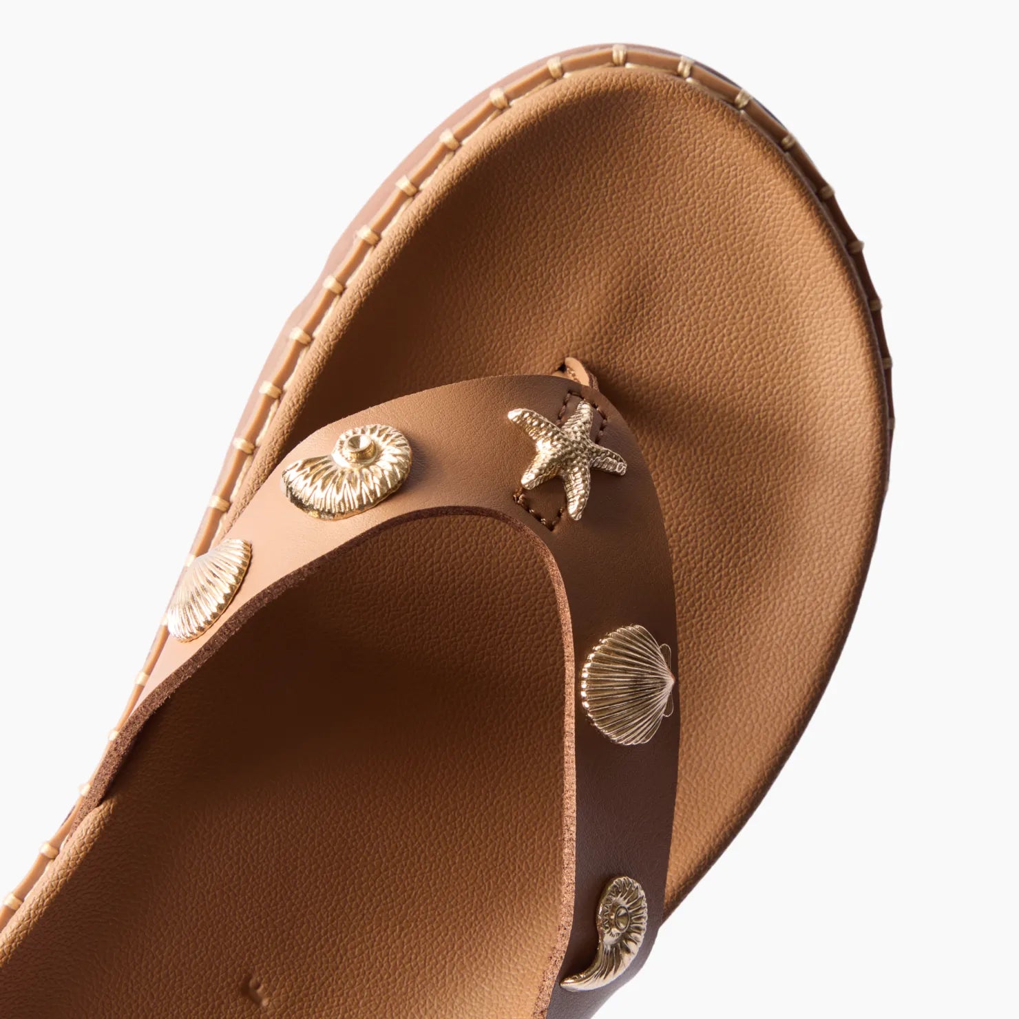 Vista Luxe Vivianahh sandal facing right with tan footbed and gold seashell accents, close-up on toe strap for comfort.