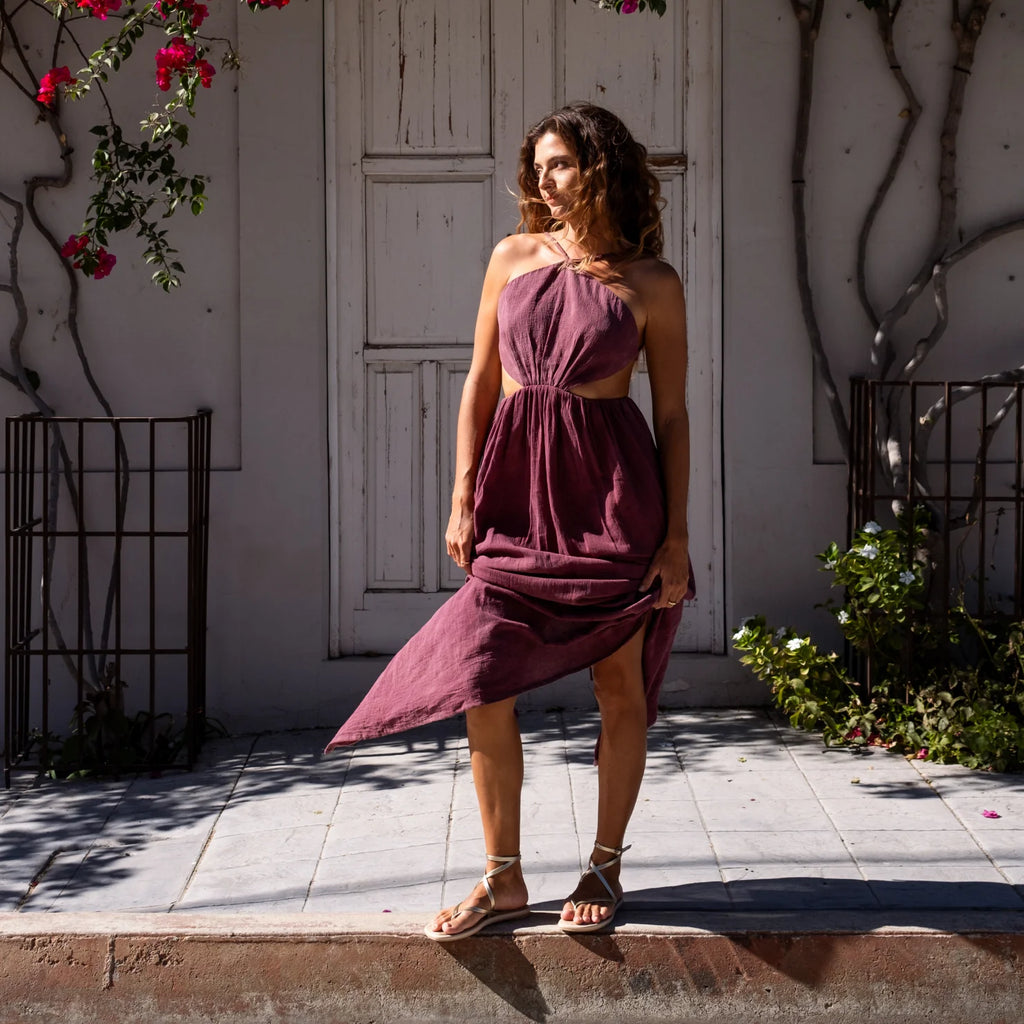Willow Quinn sandals facing forward on woman standing in a purple dress outdoors, highlighting comfort and beach-inspired style.