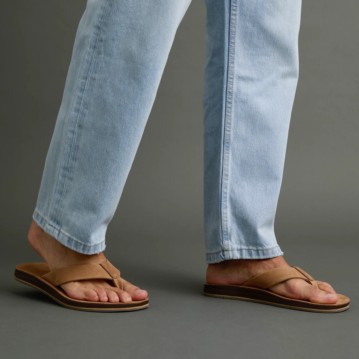 Ojai Classic tan sandals on feet facing right, showing soft-rebound cushioning and anatomical arch support for comfort.