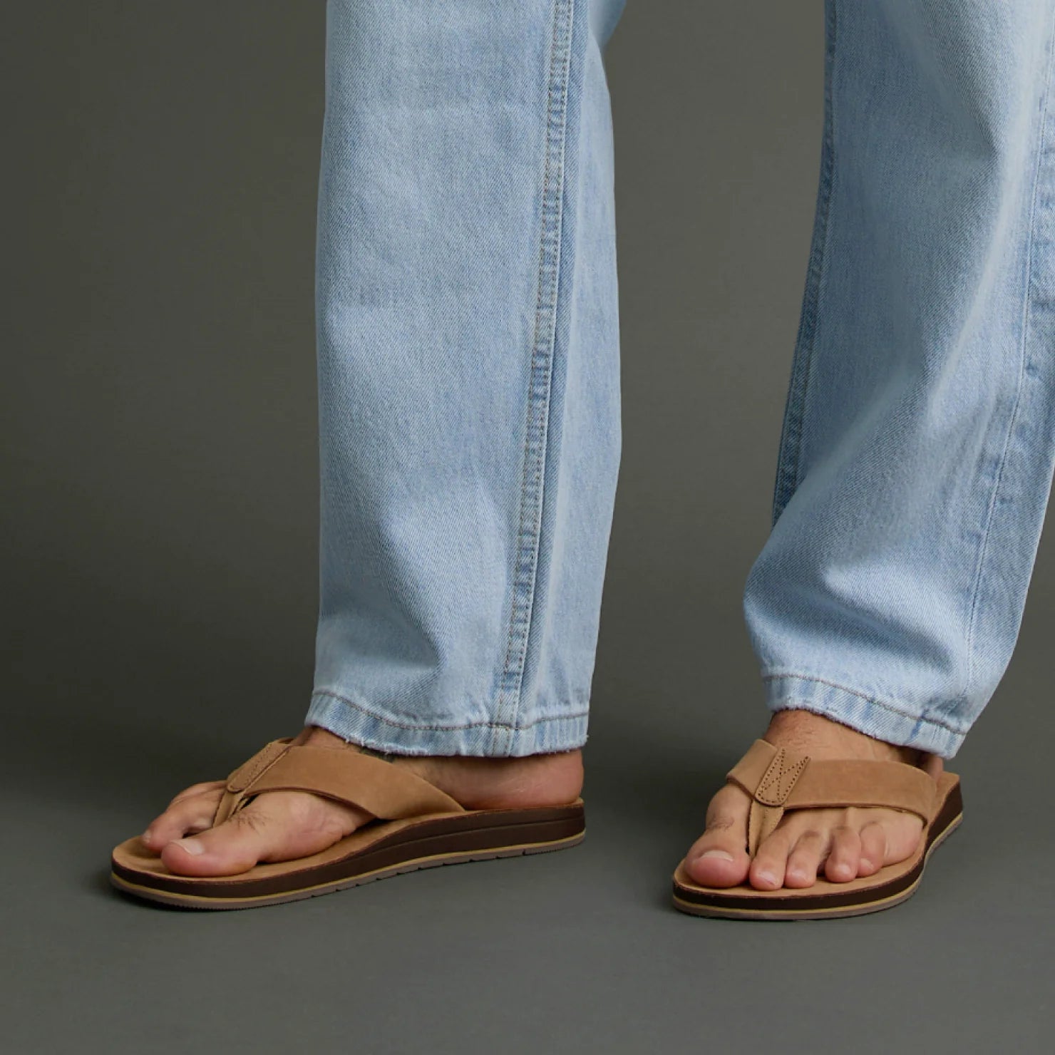 Ojai Classic tan sandals on men's feet facing forward, featuring comfort cushioning and anatomical arch support.