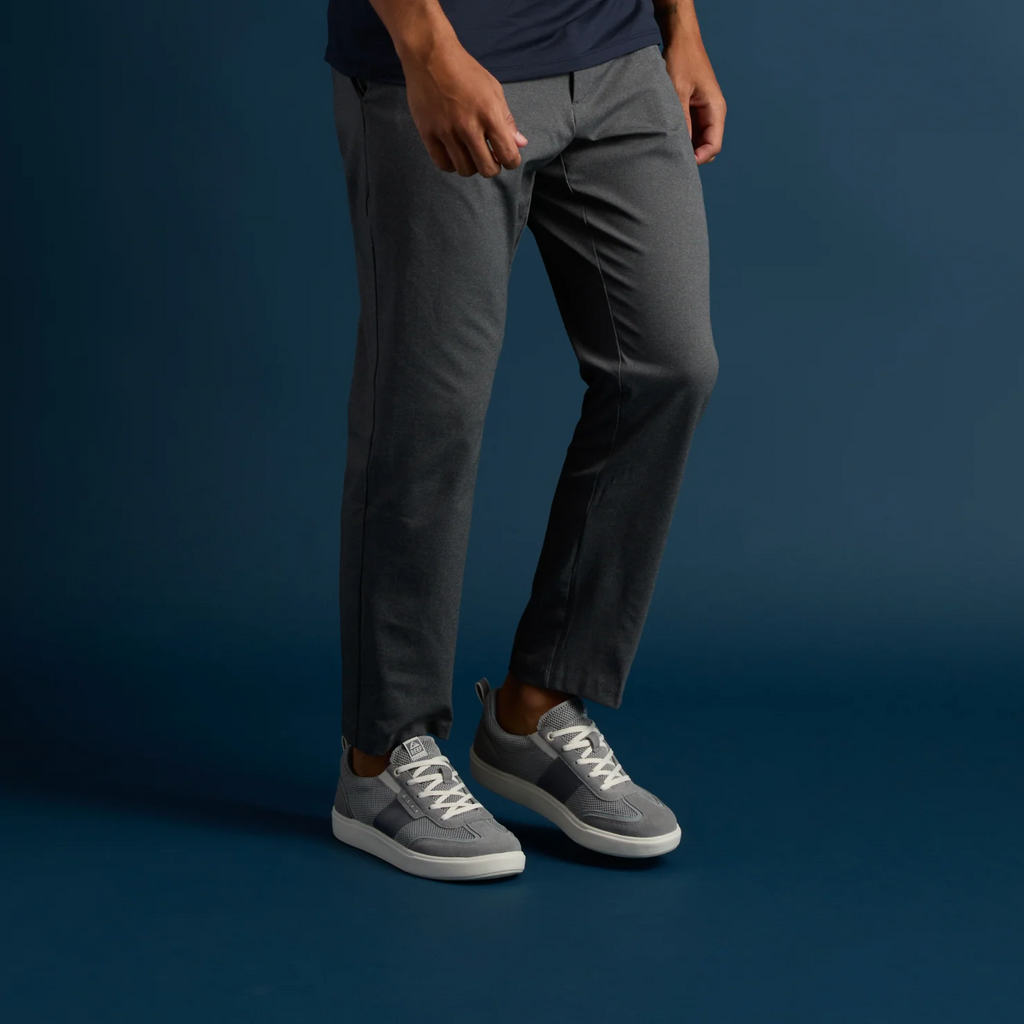 Triton men's grey sneaker facing right, showing side and top with cushioning and arch support, beach-inspired comfort