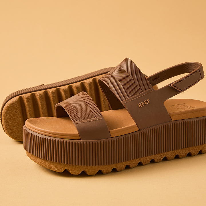Close-up of the right-facing "Water Vista Higher" sandal in espresso brown, featuring textured straps and cushioned platform sole.