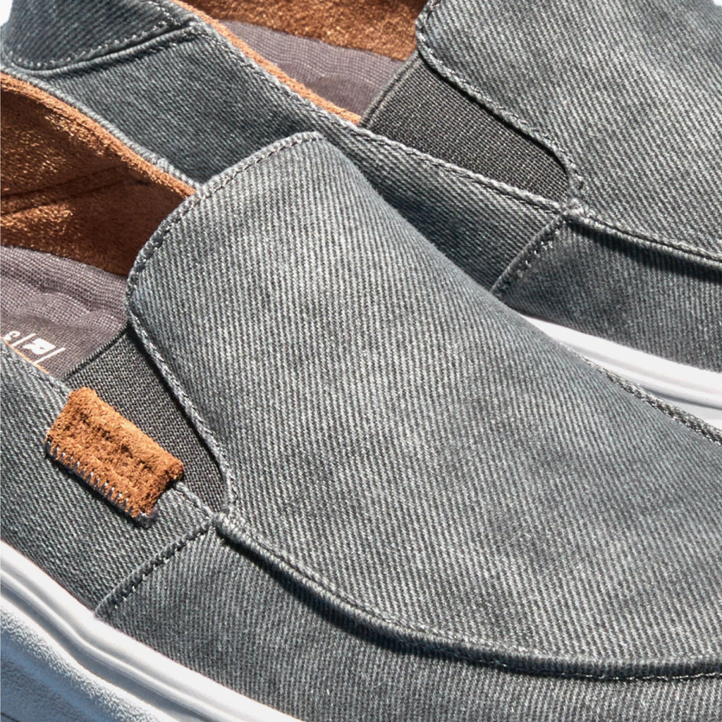 Close-up of the Pacific men's slip-on shoe in smoke gray facing left, featuring soft cushioning and arch support.