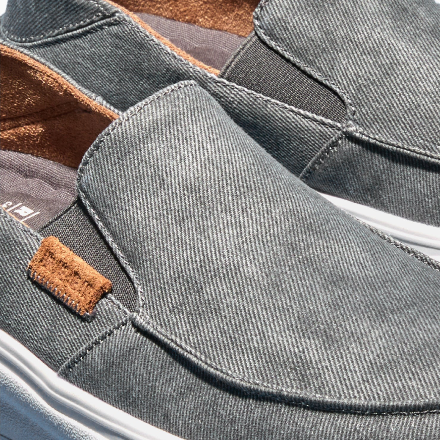 Close-up of the Pacific men's slip-on shoe in smoke gray facing left, featuring soft cushioning and arch support.