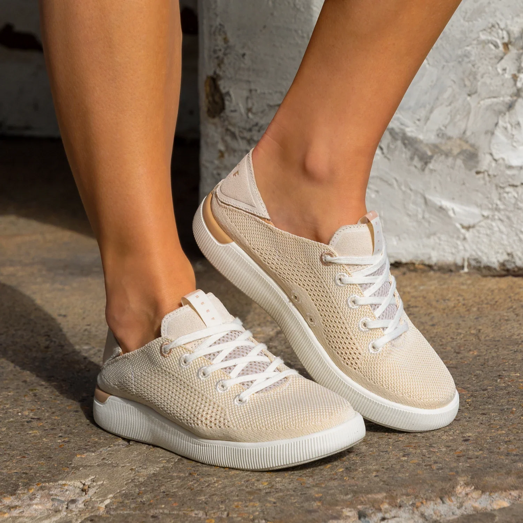 Reef Neptune beige women's sneaker facing left with lightweight mesh, arch support, and soft-rebound cushioning.
