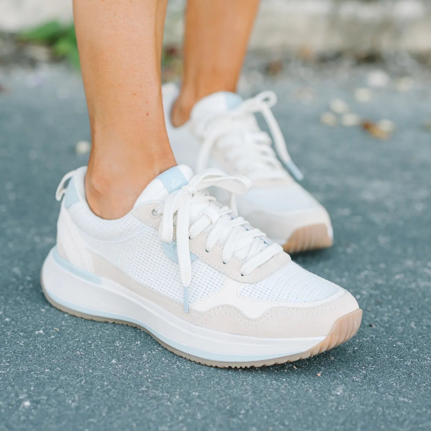 Venice Sonny x Jenny sneakers facing left on pavement, featuring breathable mesh, cushioned sole, and arch support for comfort