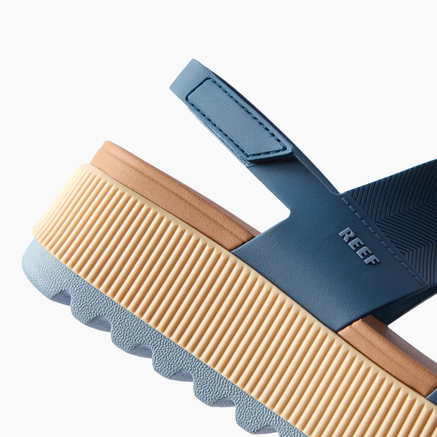 Water Vista Higher sandal close-up of rear right side showing adjustable navy strap, tan midsole, and textured sole grip