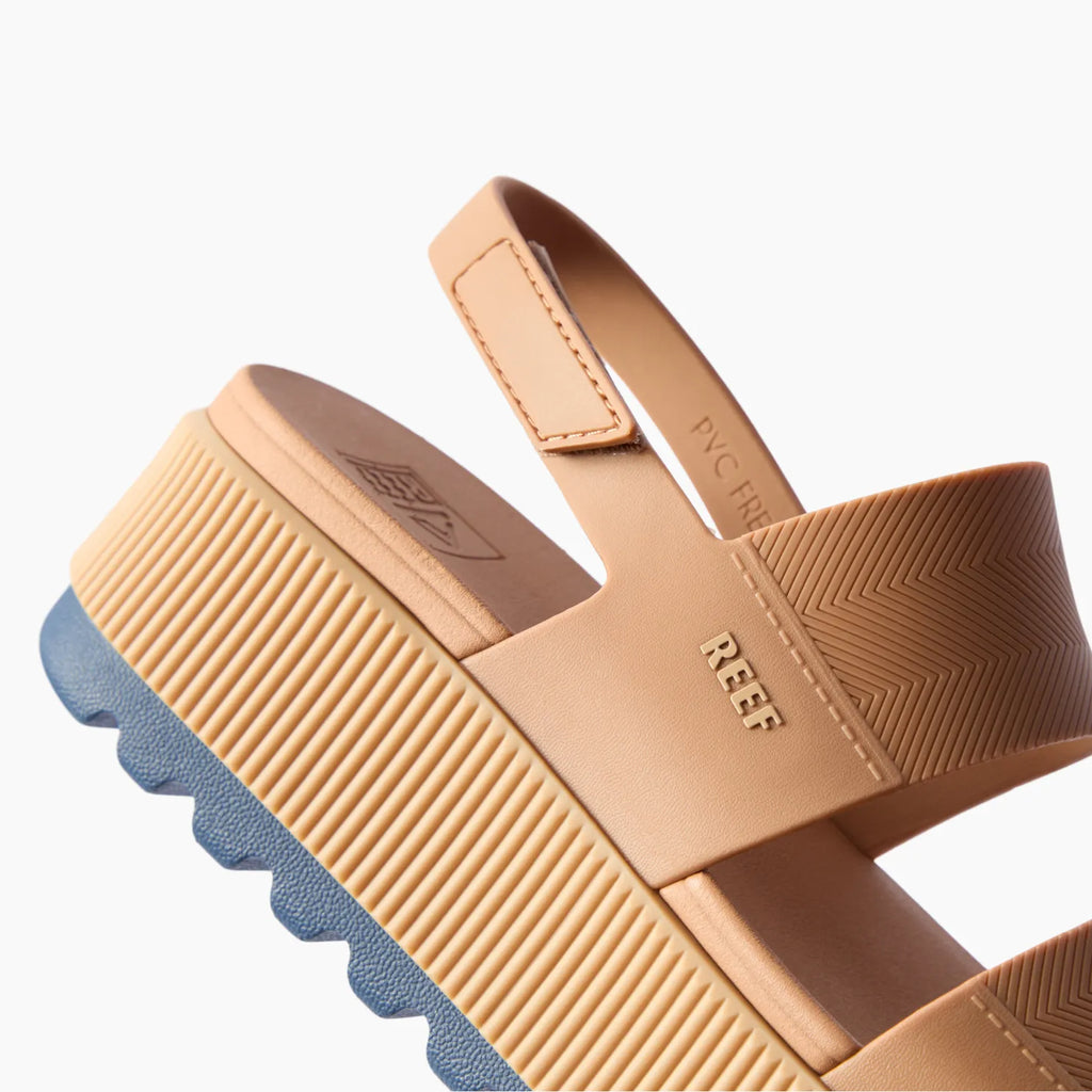 Water Vista Higher sandal close-up of heel and navy sole facing left with adjustable tan straps and platform for beach comfort