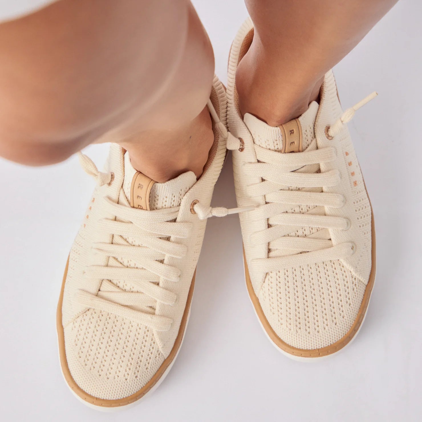 Top view close-up of women's Lay Day Lite shoes facing forward, featuring breathable material and REEF comfort design.