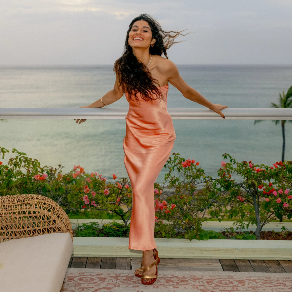 Woman wearing Vista Isabella sandals facing forward, showing comfort-focused design with ankle straps by the beach.