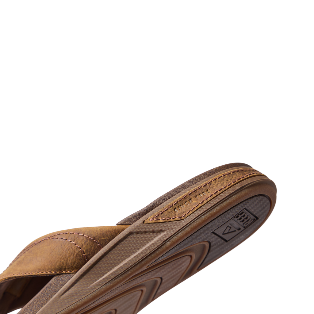 Phantom Lux sandal in toffee facing right, showing close-up of cushioned arch support and durable sole.