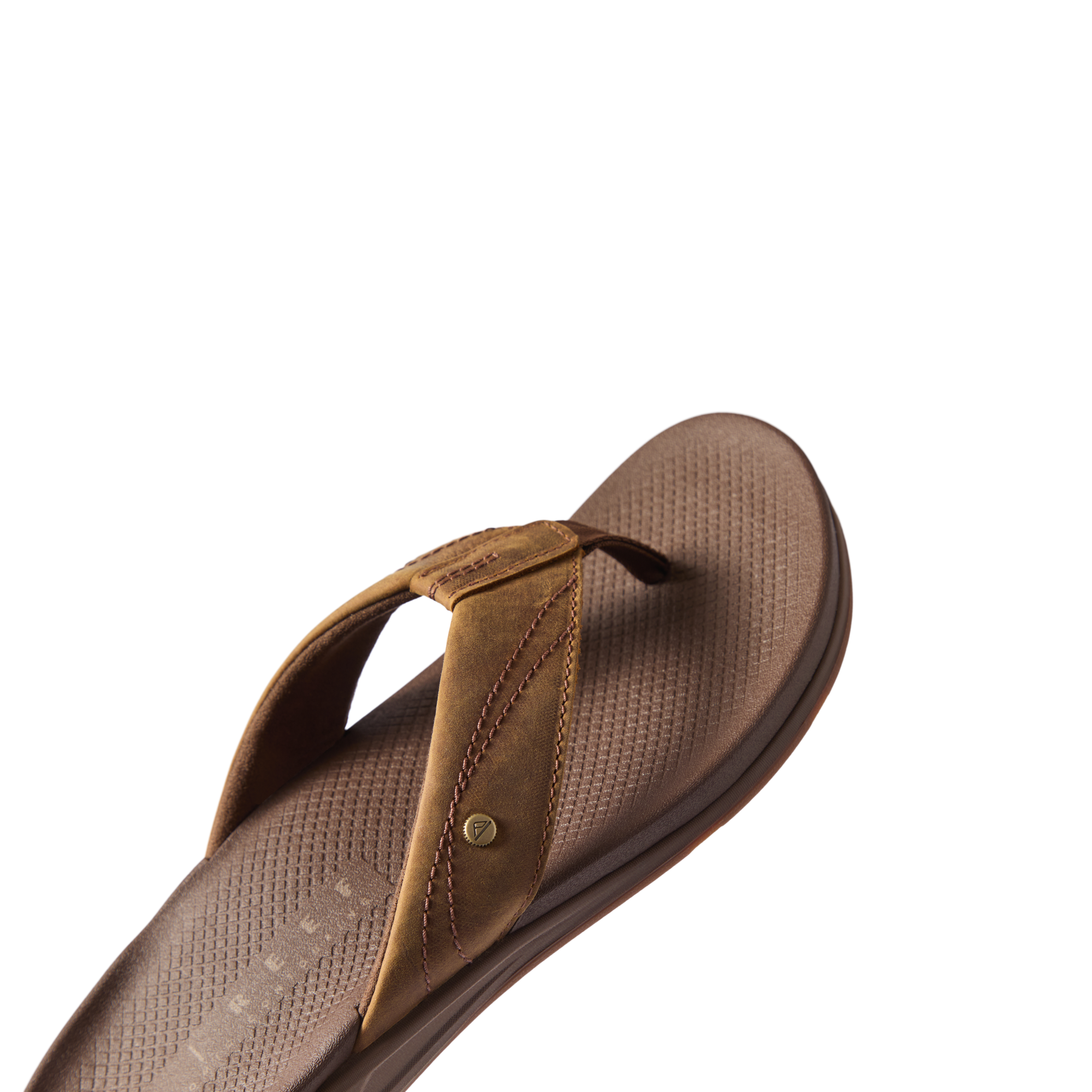 Phantom Lux men's sandal facing right, close-up of cushioned footbed and soft toffee brown straps for beach comfort.