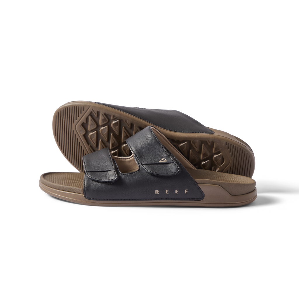 Phantom Tradewind men's slide sandals facing left, close-up of cushioned footbed and adjustable straps.