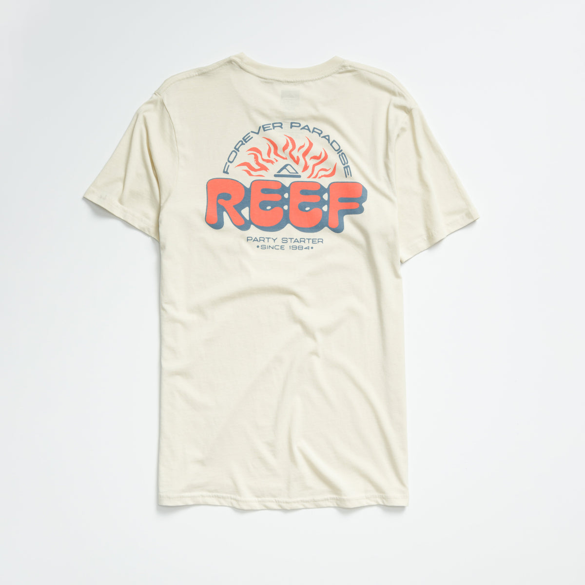 Quinn Tee in almond milk color showing back with REEF logo, sun graphic, and "Forever Paradise" text, men’s apparel.
