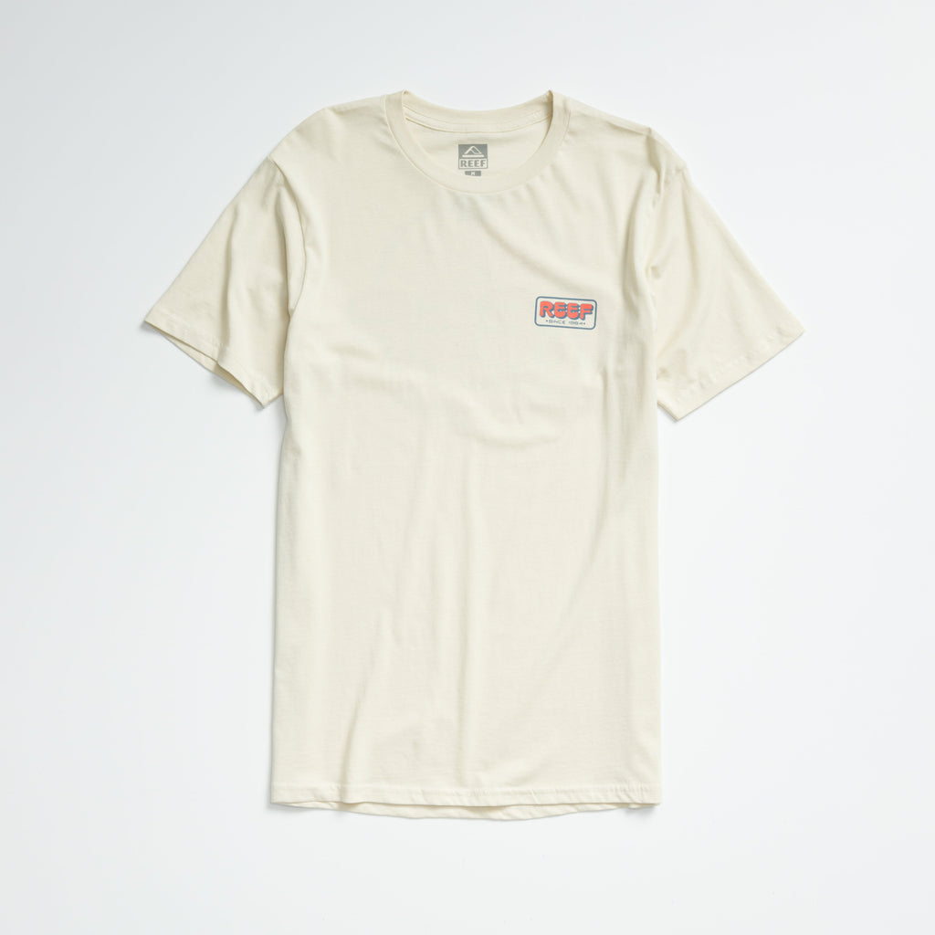 Quinn Tee in almond milk color, laid flat showing front with small REEF logo on chest, lightweight comfort apparel.