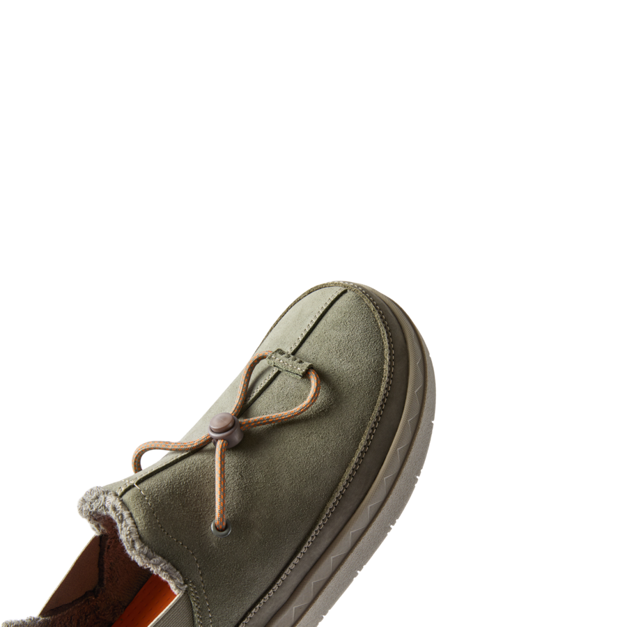 Rambler shoe facing left, close-up on front with soft suede upper, elastic laces, and cushioned sole for all-day comfort.