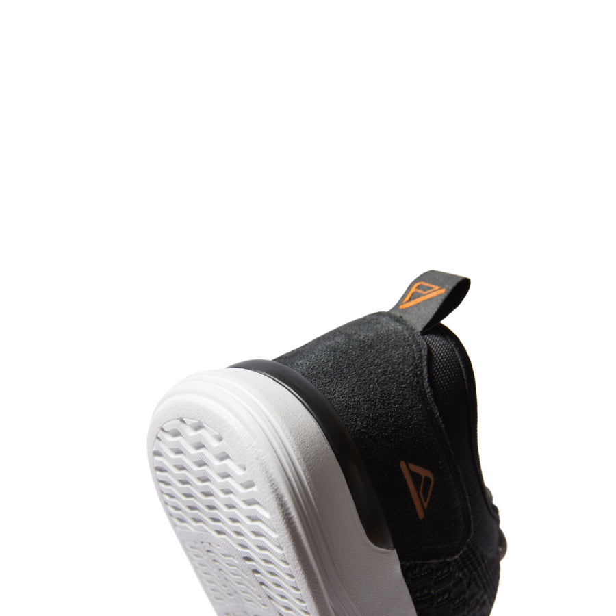 Neso men's footwear showing the heel facing forward with soft-rebound cushioning and anatomical arch support.