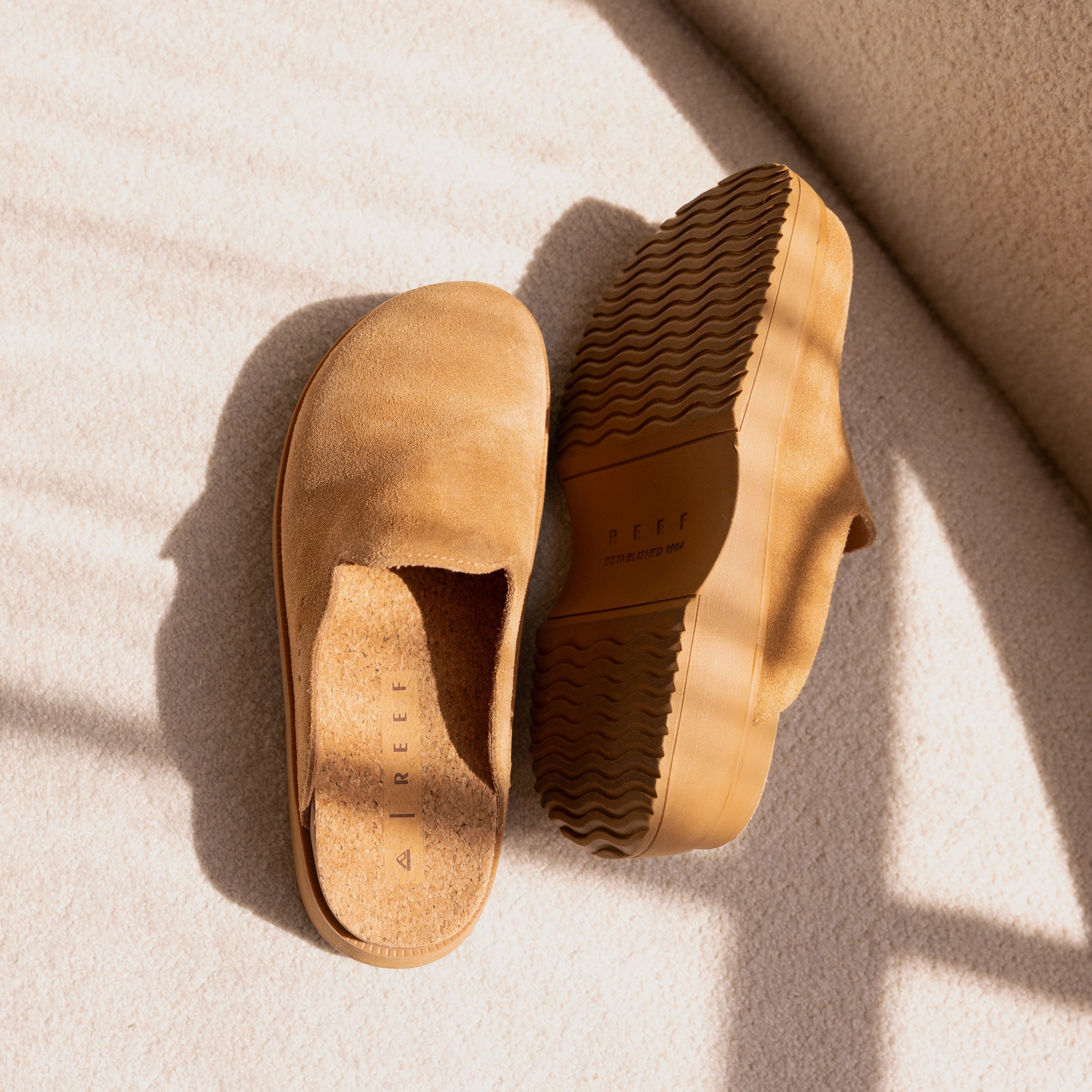 Top view of tan suede Vista Skye clog with sole facing right, showcasing comfort-focused arch support and platform design.
