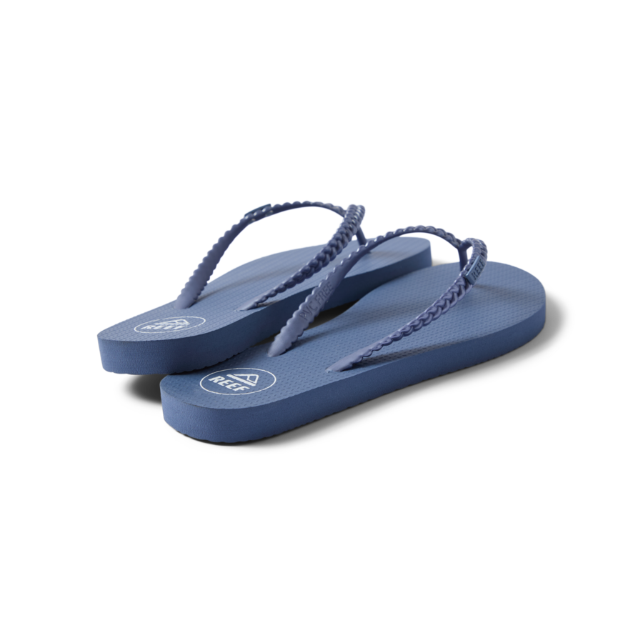 Seaside Twist women's indigo flip flops facing right, showing lightweight, cushioned footbed and braided straps.