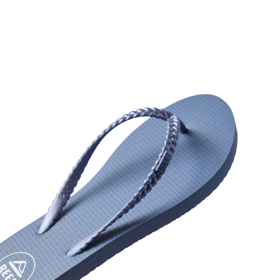 Seaside Twist women's flip flop facing right with braided straps, cushioned footbed, and water-friendly design.